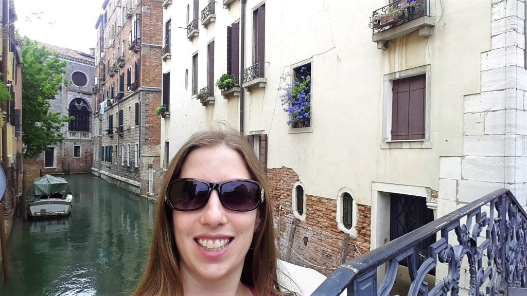 I am all smiles strolling around Venice, Italy and the side canals
