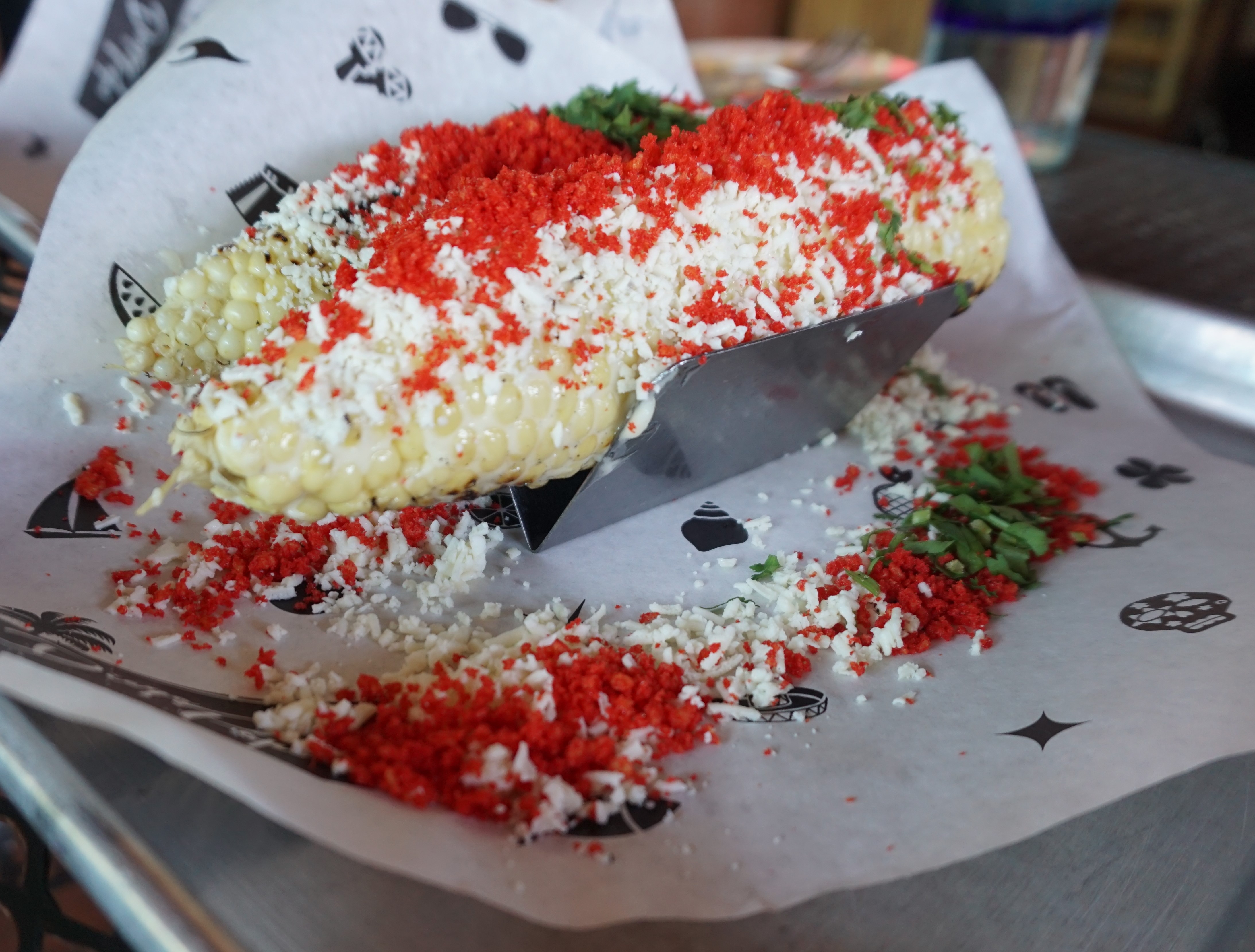 Grilled street corn with cotija cheese and crushed Cheetos at Diego Pops Scottsdale Food Guide - Best Restaurants in Old Town Scottsdale, Arizona